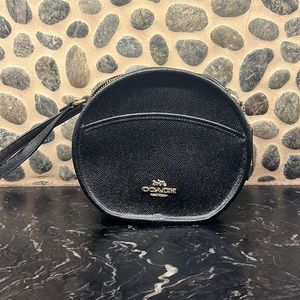 Round black leather Coach crossbody Purse